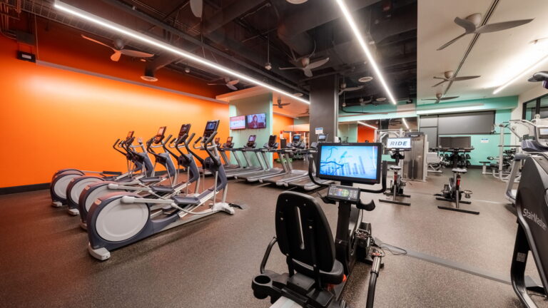 Twenty-four hour fitness center featuring Peloton Studios
